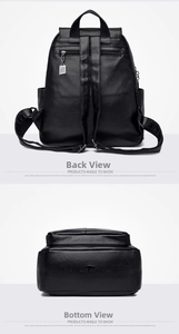 Detail of black lychee leather backpack showing anti-theft back pocket and reinforced base