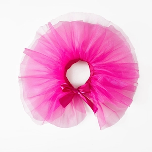 Detailed view of pink pet tutu skirt with multi-layer mesh and satin bow decoration