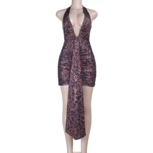 Detail of sexy leopard print mini dress with deep V-neck and halter neck draping design