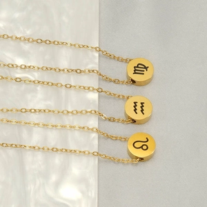 Three gold stainless steel zodiac coin necklaces featuring Virgo, Aquarius, and Leo signs