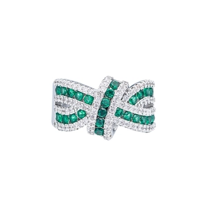 Luxurious criss-cross ring with green and white zircon crystals on a silver band