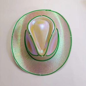 Macro shot of iridescent cowboy hat with green LED neon light trim for rave parties