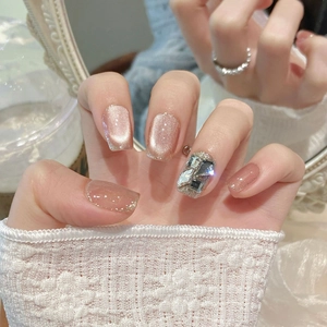Pink cat eye press-on nails with champagne rhinestones and glitter for women