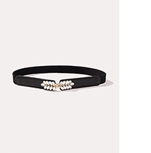 Close-up of black elastic waist belt featuring white leaf-shaped decorative buckle