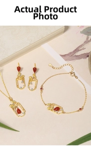 Detail of 925 silver necklace with red agate drop pendant and ginkgo leaf elements