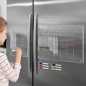 Clear acrylic magnetic weekly planner and to-do list set used on a stainless steel fridge