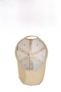 Detail view of cotton baseball cap interior showing reinforced seams and adjustable strap