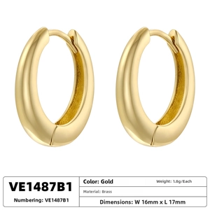 Detailed view of gold oval hoop earrings with 16mm width and 17mm length specs