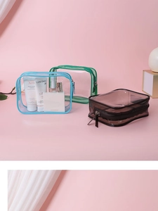 Three transparent PVC toiletry bags in blue green and brown for travel storage