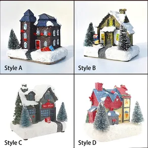 Luminous Christmas village house set with snow miniature cottages and colorful lights