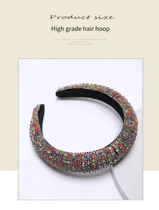 Close-up of multicolored rhinestones and black velvet lining on a baroque style headband