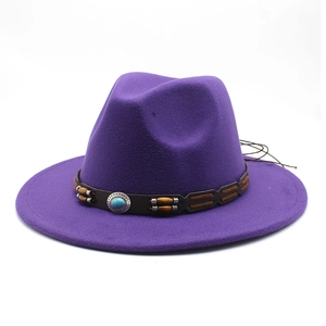 Detail of purple wide brim fedora featuring brown leather band and turquoise metal buckle