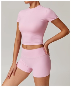 Pink brushed yoga set featuring short sleeve crop top and high waist compression shorts