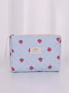 Quilted strawberry print cosmetic bag with blue stripes and zipper closure