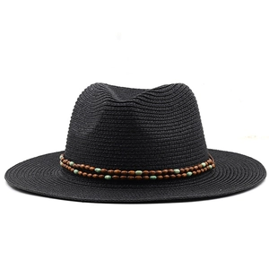 Detail of black straw fedora hat with double-row wooden and turquoise beaded band