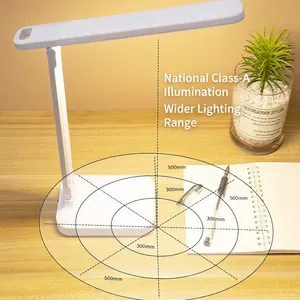 White foldable LED desk lamp for eye protection with adjustable head on a wooden table