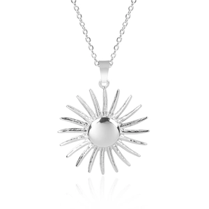 Detailed view of a silver sun pendant necklace with polished stainless steel finish