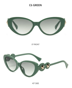 Green cat eye sunglasses featuring gold metal star accents on the temple arms