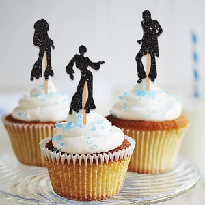 Three black glitter disco silhouette cake toppers on cupcakes for party decoration