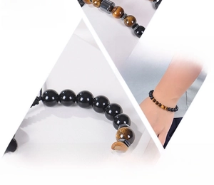 Macro detail of natural tiger eye and hematite stone beads on a woven bracelet cord