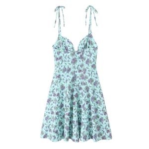 Detail of light blue floral poplin dress featuring purple prints and bow shoulder straps