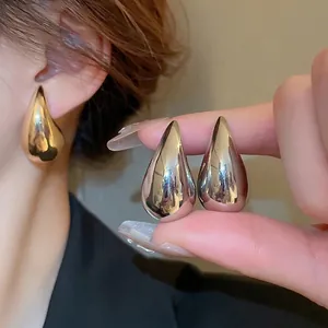 Chic silver teardrop earring set with polished finish for a modern minimalist look