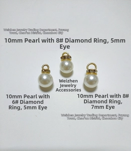 Detail of 10mm high-gloss ABS pearls with gold rhinestone spacers for DIY jewelry crafts