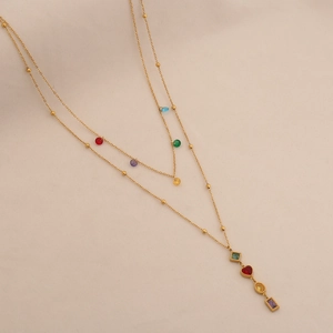 Double-layered gold Y-necklace featuring colorful glass beads and geometric stone pendants