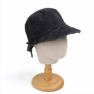 Detail of adjustable elastic drawstring buckle on denim sun hat for custom fit