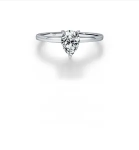 Detailed view of teardrop pear-cut moissanite and S925 silver stamp on minimalist ring