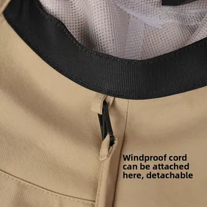 Detail of khaki sun hat featuring detachable wind rope hook and breathable mesh lining