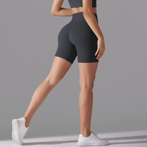 Close-up of high-waisted gray yoga shorts featuring a seamless push-up lift for fitness