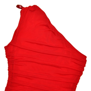 Detail of red one-shoulder dress showing elegant ruched fabric texture and pleated design