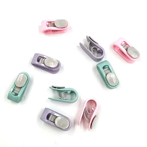 Macro view of colorful plastic quilt cover clips in various macaron colors