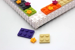 Detailed close-up of DIY building block photo frame with colorful star-shaped components