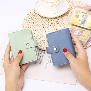 Close-up of portable lychee leather card holder with multiple transparent PVC slots