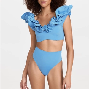 Sky blue two-piece bikini set with dramatic ruffle shoulders and high waisted bottom