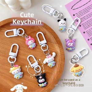 Close-up of cute cartoon character charms including Kuromi and Melody with lobster clasps