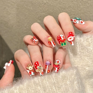 3D Christmas press-on nails featuring Santa, reindeer, and gingerbread relief designs