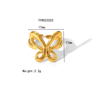 Detail view of a gold butterfly open ring showing dimensions 17mm and 2.2g weight