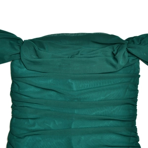 Detail of the mesh texture and ruched design on this emerald green off-shoulder dress