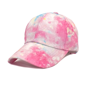 Close-up of tie-dye gradient baseball cap featuring pink blue and yellow watercolor patterns