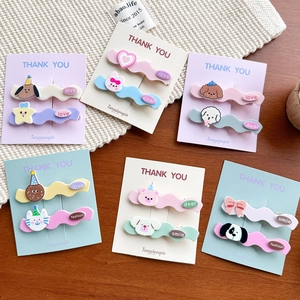 Detail of cute animal hair clips in pastel colors with stars and heart shapes