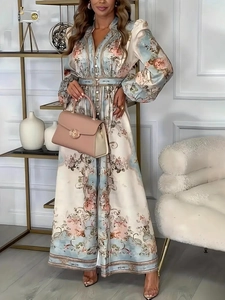 Elegant floral V-neck maxi dress with puff sleeves and belted waist for a chic look