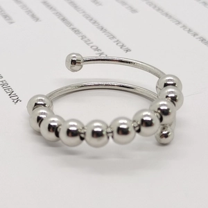 Polished stainless steel anxiety ring with movable beads and adjustable open band design