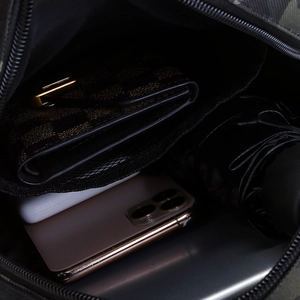 Tactical camo shoulder bag with spacious interior for wallet, phone, and folding umbrella