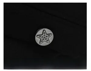 Close-up of winter flat top cap with silver star button and durable stitching detail