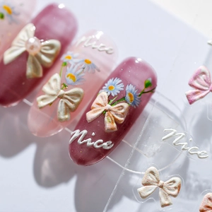 3D embossed butterfly bow and daisy nail art stickers in soft purple and pink tones