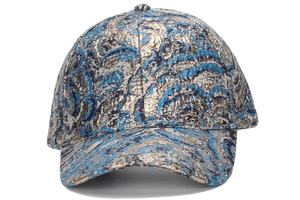Detail of blue and gold paisley jacquard pattern on a metallic stylish baseball cap