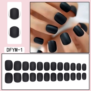 Close-up of matte black short square press-on nails with full 24-piece size set display